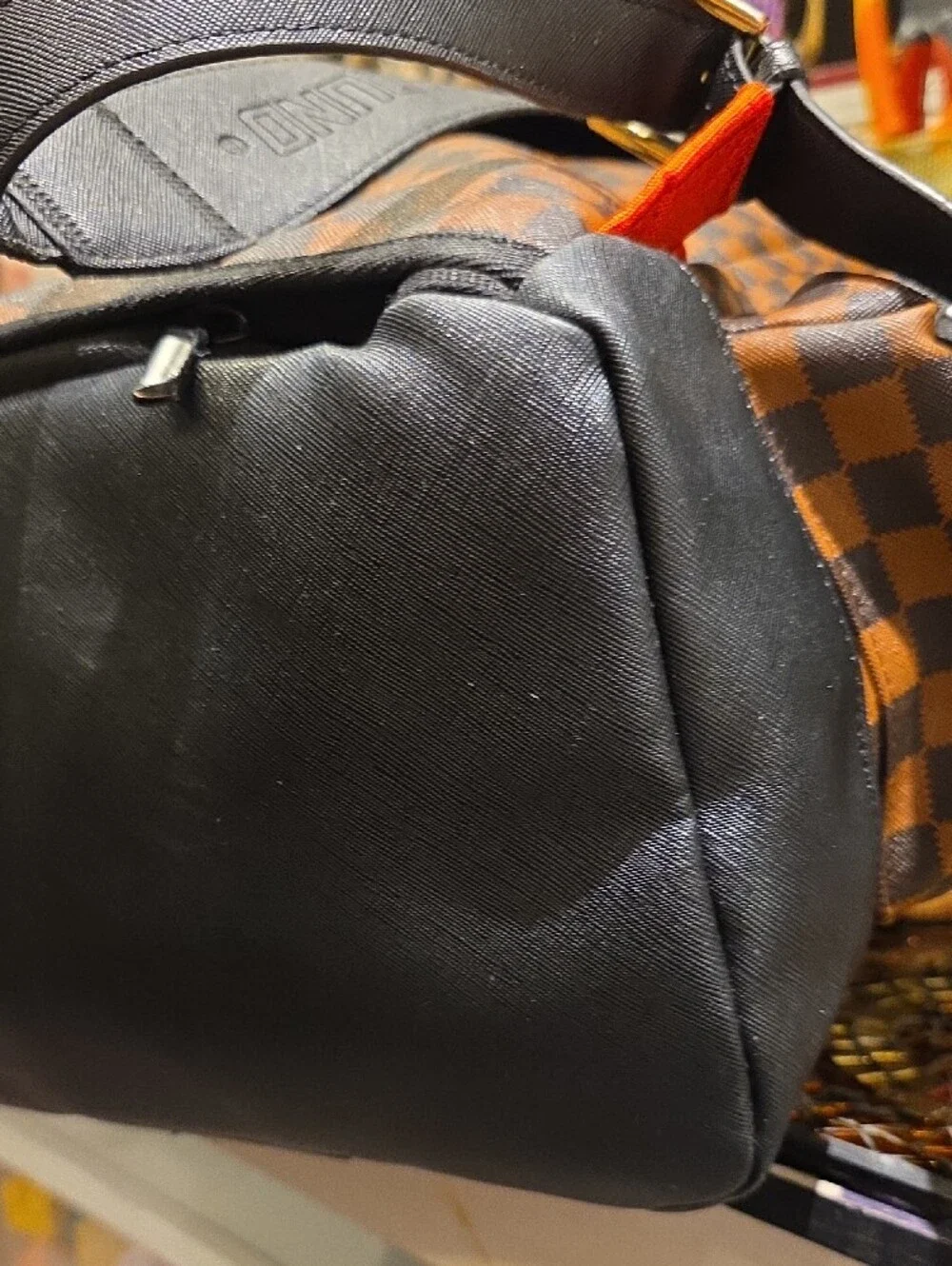 Sprayground Brown Checkerboard Backpack with Black Trim and Red Accent